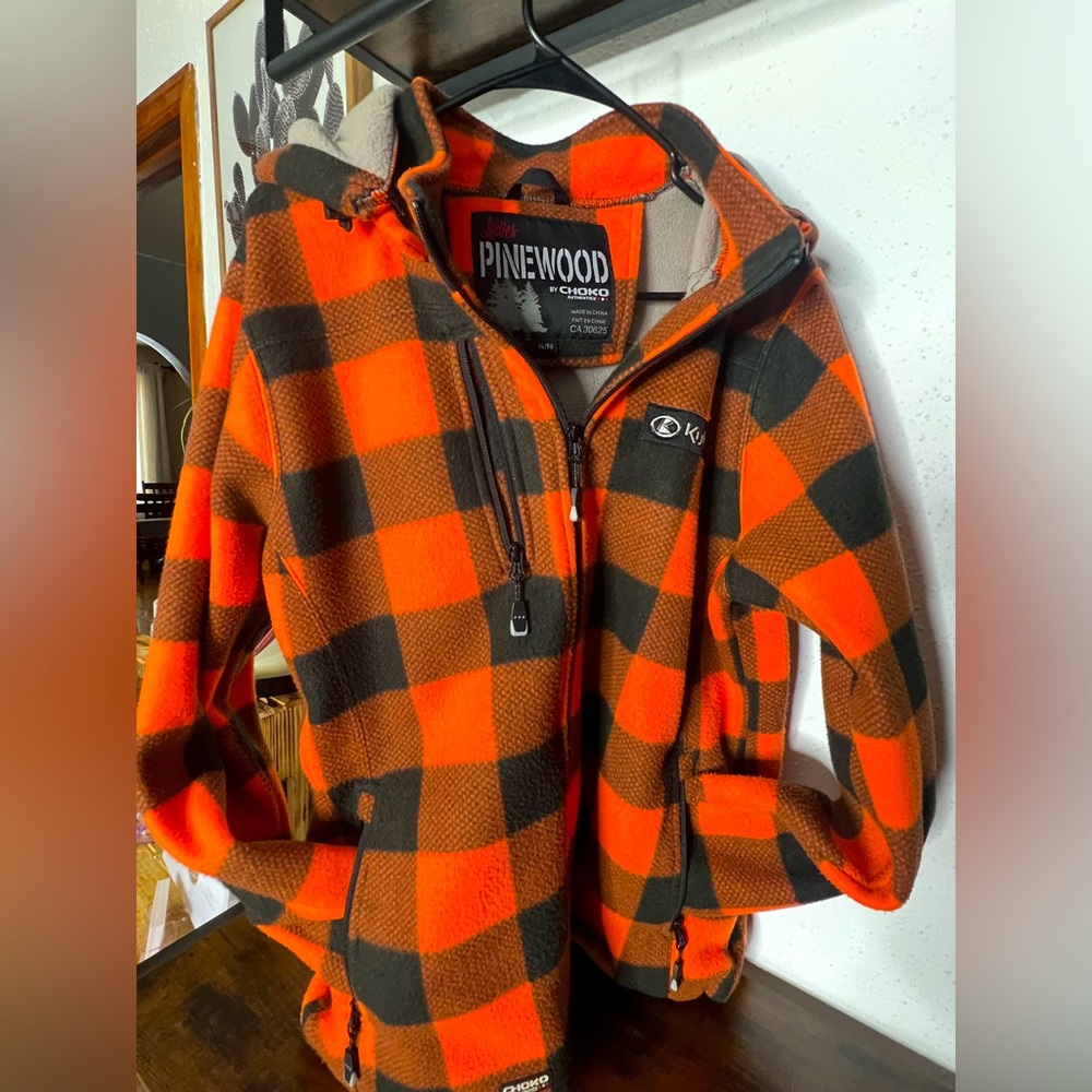 Kubota plaid jacket. Very warm!! Removable hood. Non smoking home.